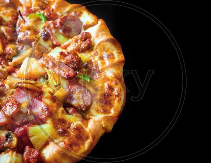 Top View Of Half Pizza With Cheese Ham Bacon And Pepperoni On Isolated Black Background With Hot Steaming Smoke. Food And Cooking Concept. Lunch Time Serve And Hungry Theme. Pizza Delivery Service