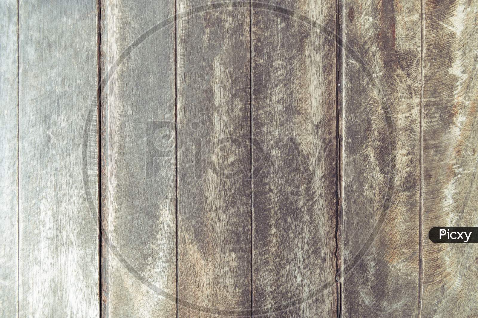 Closeup Of Old Brown Wooden Plank Texture Background. Wallpaper Backdrop. Abstract Wood Floor And Wall Structure. Top View Angle. Vertical Pattern