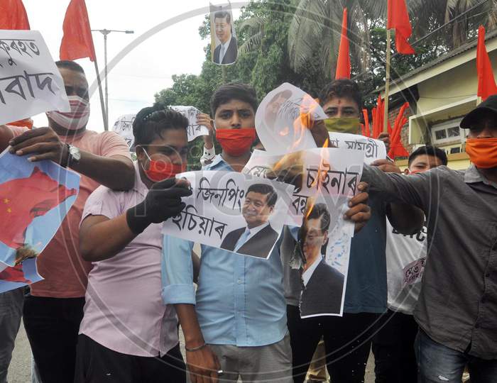 Activists Of Bharat  Raksha Manch Burn A Photo  Of Chinese President Xi Jinping During A Protest Against China Over Galwan Valley Incident, In Guwahati On June 18, 2020.