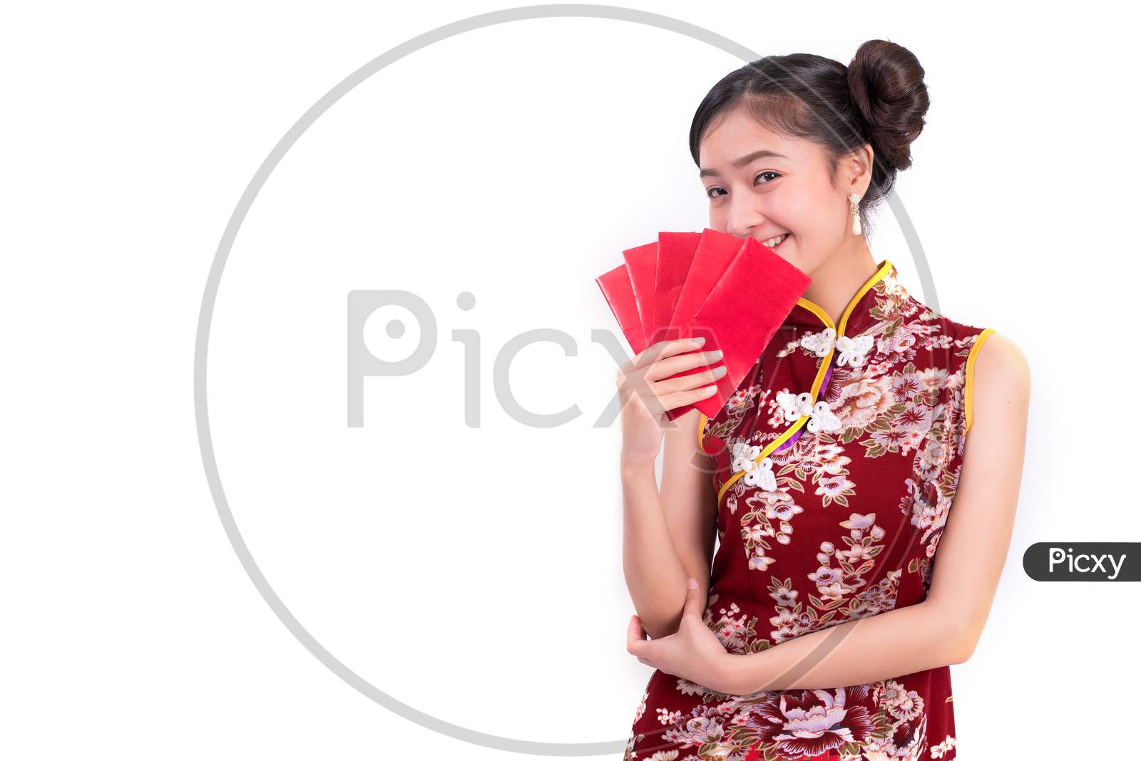 Young Asian Beauty Woman Wearing Cheongsam And Holding Packet Of Moneys Gesture In Chinese New Year Festival Event On Isolated White Background. Holiday And Lifestyle Concept. Qipao Dress Wearing