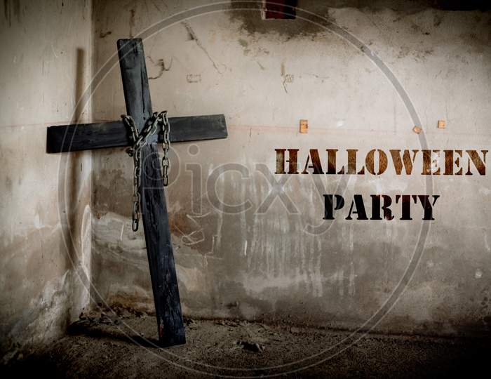 Black Cross Against The Wall With Hanging Steel Chain, Halloween Party Festival Posture Advertising. Halloween'S Day And Ghost Concept. Dark And Scary Tone Tone Pinterest And Instragram Like Process.