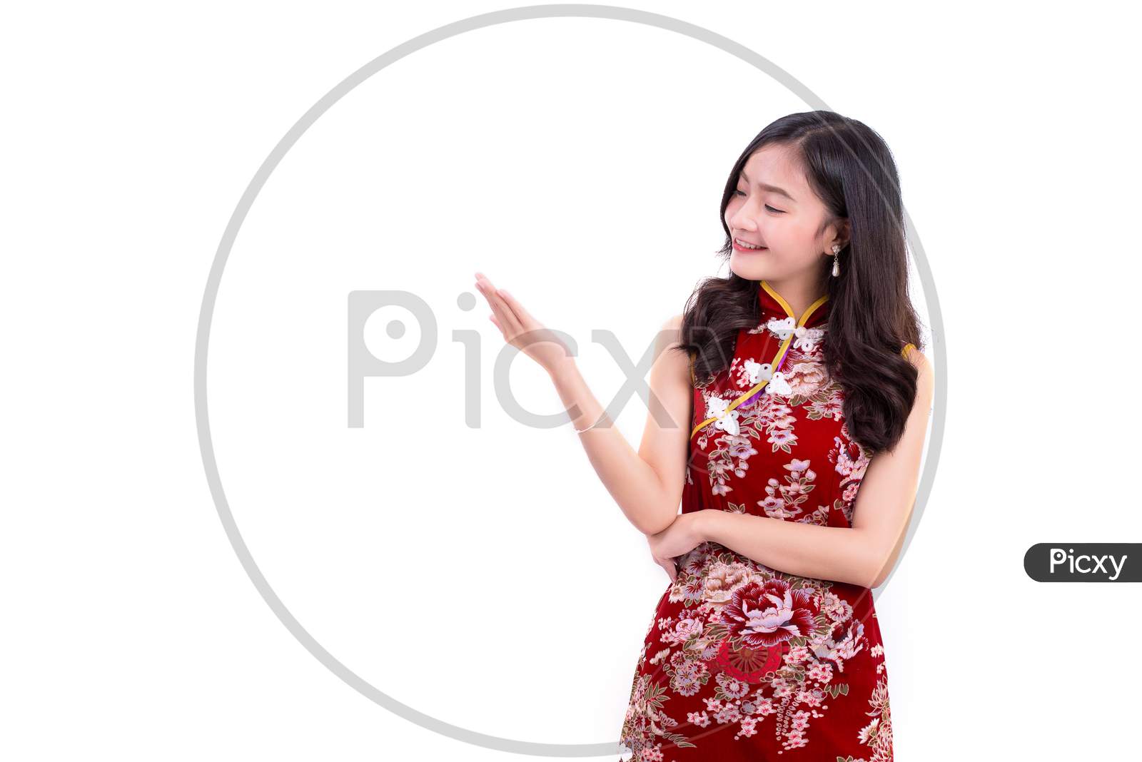 Young Asian Beauty Woman Wearing Cheongsam And Presenting With Hands Gesture In Chinese New Year Festival Event On Isolated White Background. Holiday And Lifestyle Concept. Qipao Dress Wearing