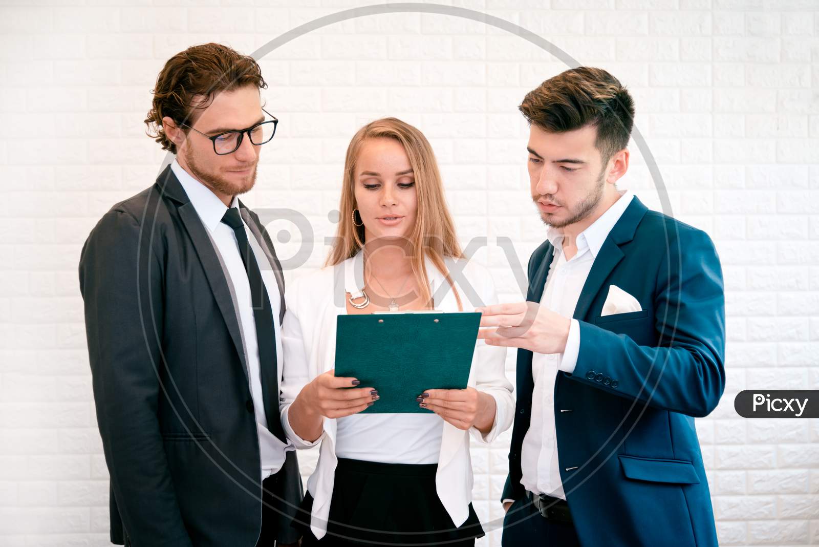 Three Business People Are Looking At The Summary Report And Consult Together, Indoors  Businessman And Businesswoman Concept, Meeting And Consulting Concept