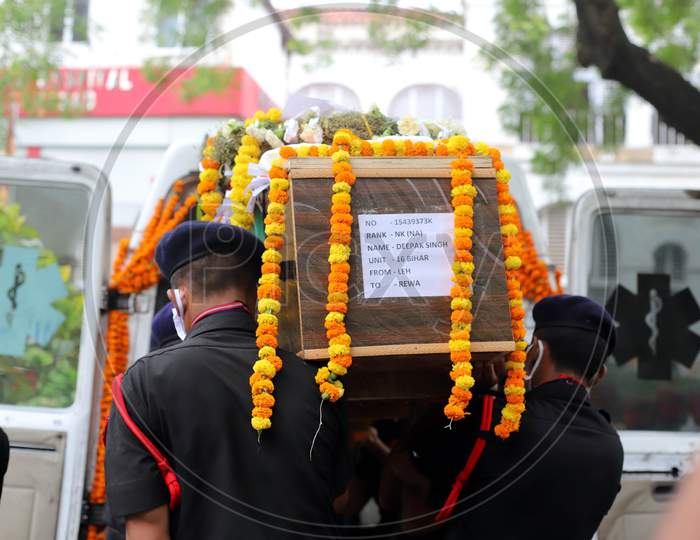 Indian Army Jawans carry the Mortal Remains of N K Deepak Singh, An Indian Soldier Who Was Killed In A Border Clash With Chinese Troops In Ladakh Region, during the funeral ceremony at Military Hospital In Prayagraj, June 19,2020.