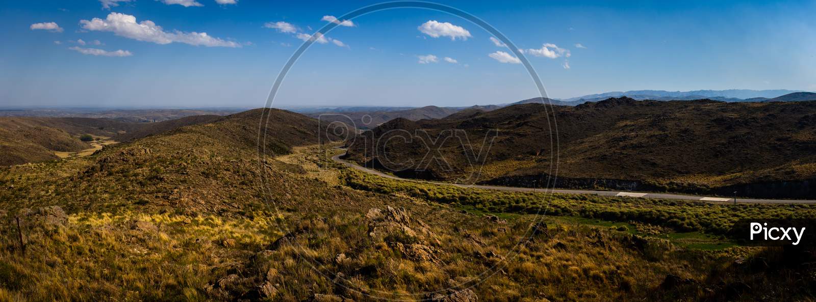Beautiful Panoramic View Of The San Luis Mountains In Argentina. Highway Runs Between Arid Mountainous Soil. Mountainous Landscape