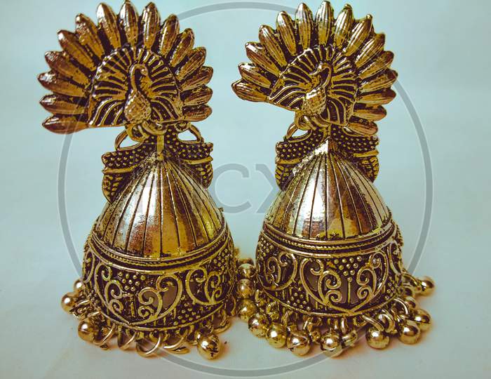 Gold earrings close-up view