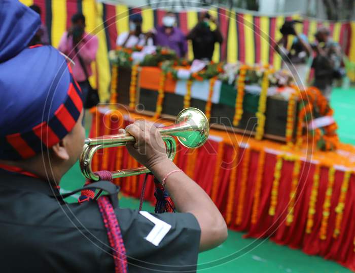 Indian Army Jawans paying official rites at the funeral of  N K Deepak Singh, An Indian Soldier Who Was Killed In A Border Clash With Chinese Troops In Ladakh Region, At Military Hospital In Prayagraj, June 19, 2020.
