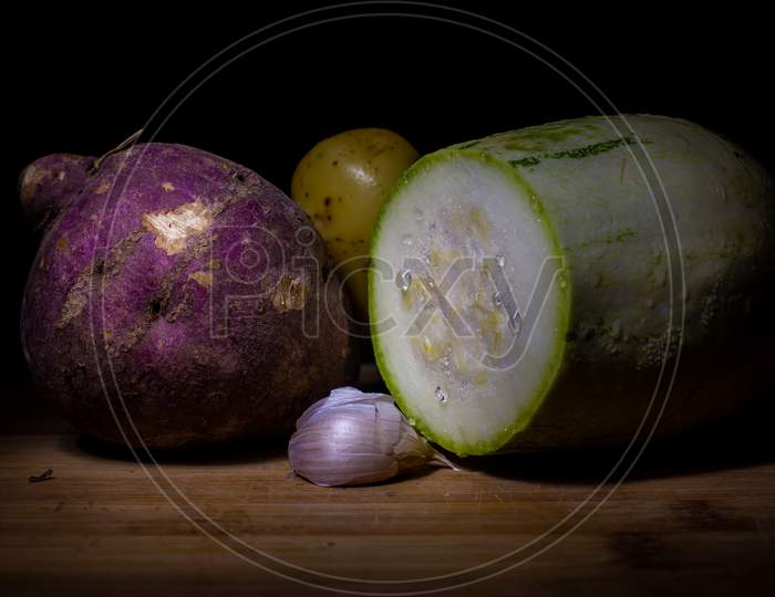 Set Of Fresh Vegetables On A Wooden Board. Black Background With Free Space To Write.