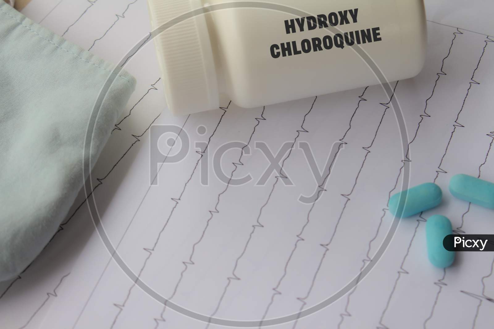 Doctor'S Desk. Medical Elements Related To Coronavirus. Medication Dispenser With The Word Hydroxychloroquine Written On It.