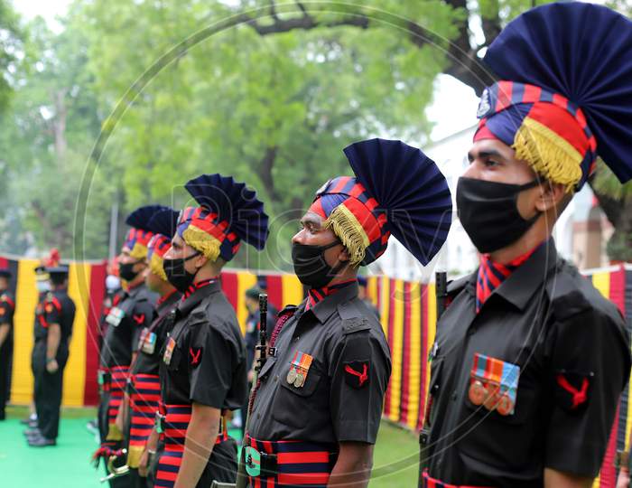 Indian Army Jawans Wearing protective face Masks during the funeral of N K Deepak Singh, An Indian Soldier Who Was Killed In A Border Clash With Chinese Troops In Ladakh Region, at Military Hospital In Prayagraj, June 19,2020.