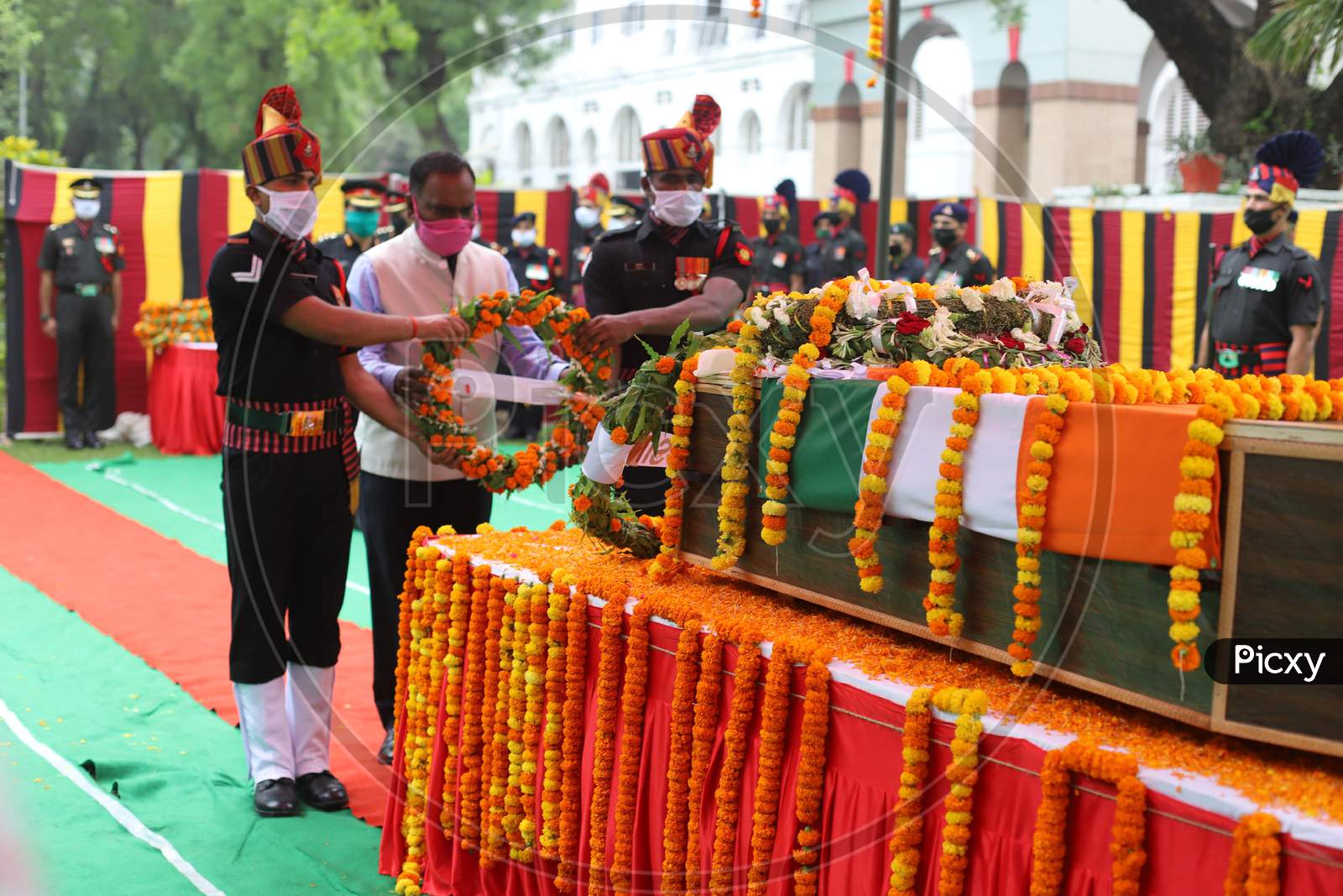 An Officer Salutes At The Coffin Of N K Deepak Singh, An Indian Soldier Who Was Killed In A Border Clash With Chinese Troops In Ladakh Region, During His Funeral Ceremony At Military Hospital In Prayagraj, June 19, 2020.