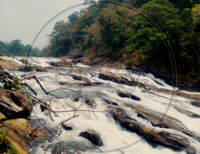 stream flowing through the rocks in Kerala