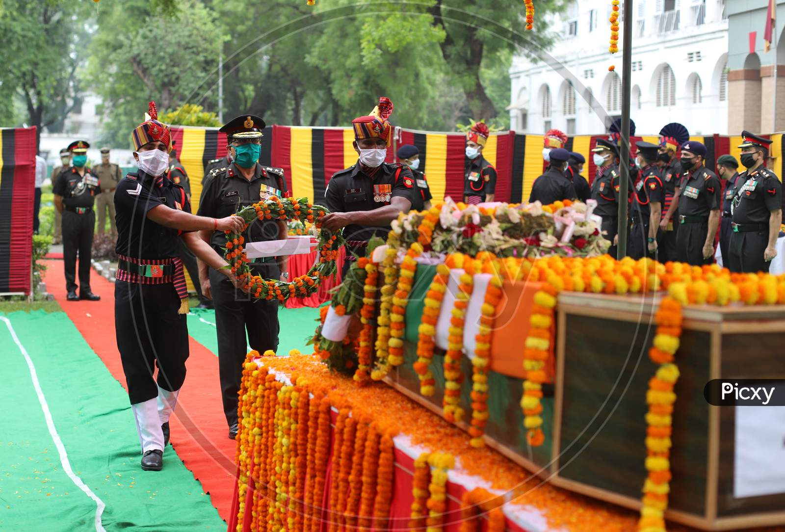 An Indian Army Officer Salutes At The Coffin of N K Deepak Singh, An Indian Soldier Who Was Killed In A Border Clash With Chinese Troops In Ladakh Region, During His Funeral Ceremony at Military Hospital In Prayagraj, June 19, 2020.