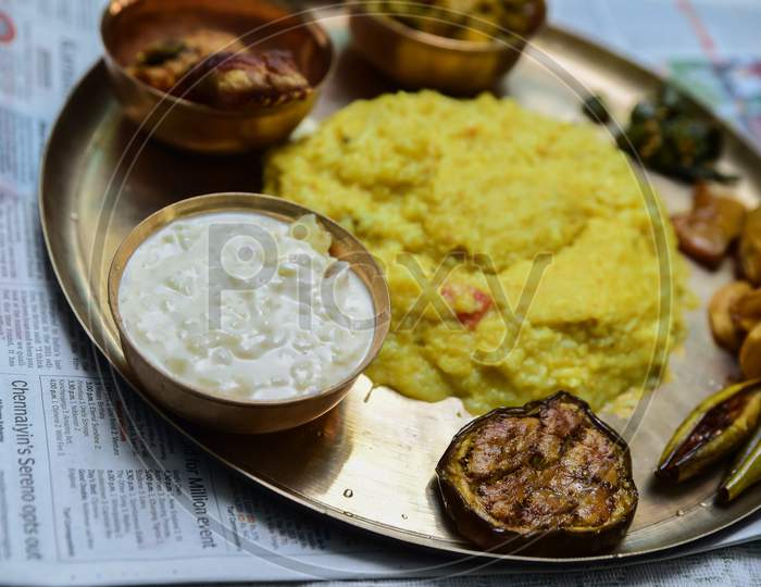 Traditional Indian dishes Paes and misti doi , blurred rice and non veg bengali meal. Special food preparation for rice ceremony in West Bengal