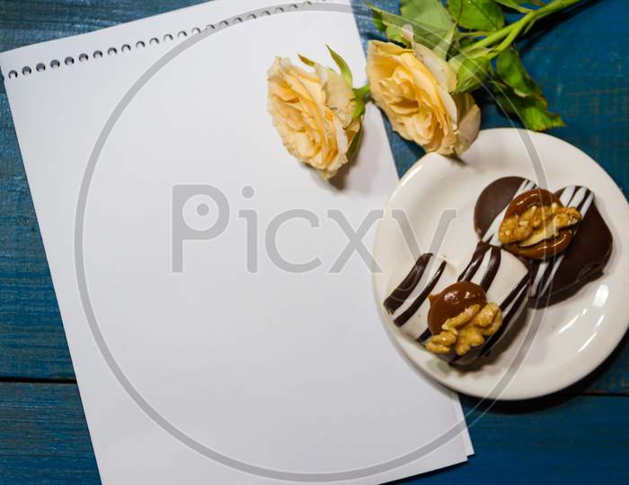 Romantic Coffee Background With Sweet Cookies And Roses With Salutations