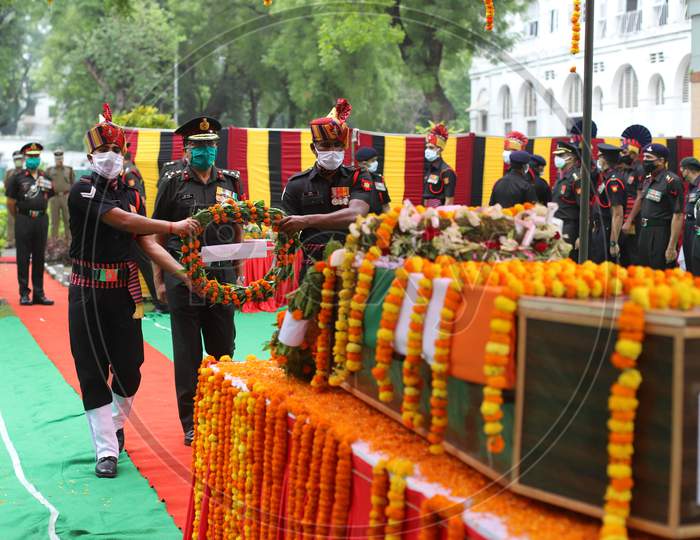 An Indian Army Officer Salutes At The Coffin of N K Deepak Singh, An Indian Soldier Who Was Killed In A Border Clash With Chinese Troops In Ladakh Region, During His Funeral Ceremony at Military Hospital In Prayagraj, June 19, 2020.