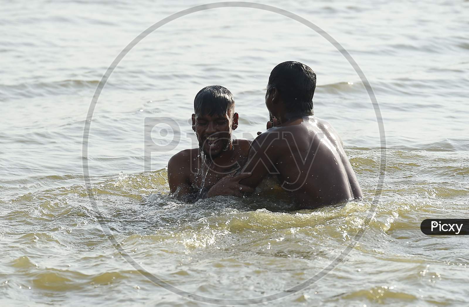 People Swim In A Lake To Beat The Heat on the Outskirts Of Chennai
