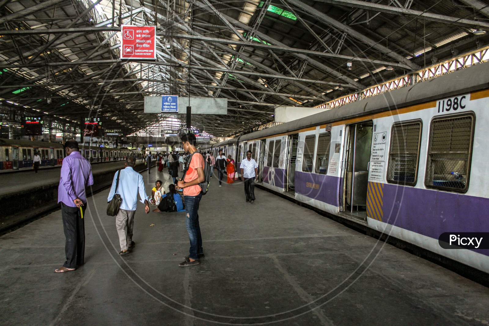 Mumbai, Maharashtra / India - June 2 2020: A Scene Of Mumbai Local At Cst Station Where People Stand In A Queue Maintains Social Distancing From Each Other During Lock Down Due To Corona Virus.