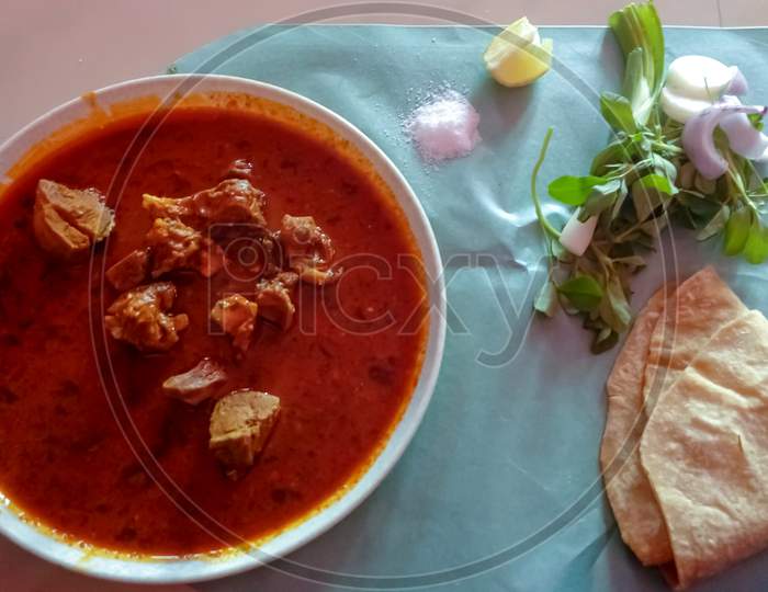 Mutton & roti Maharashtrian thali with salads