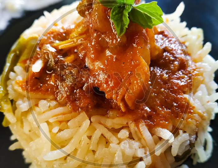 Close up of Homemade Biryani and Chicken curry