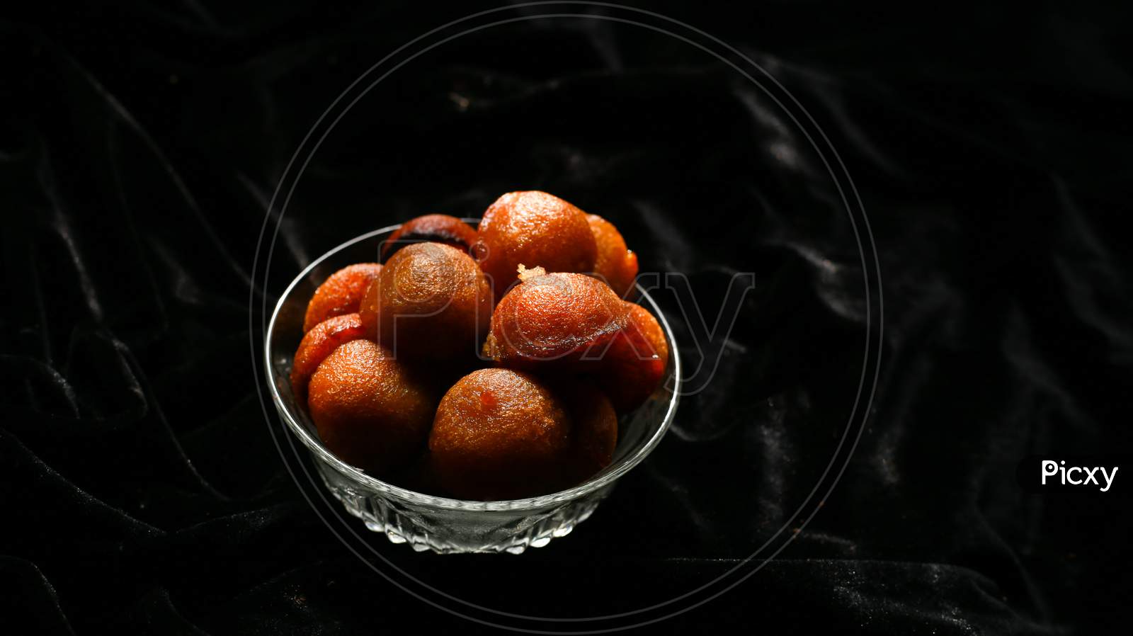Homemade Kerala snack unniyappam in dark background