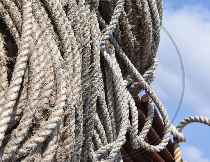 Fishing rope coiled under the sun