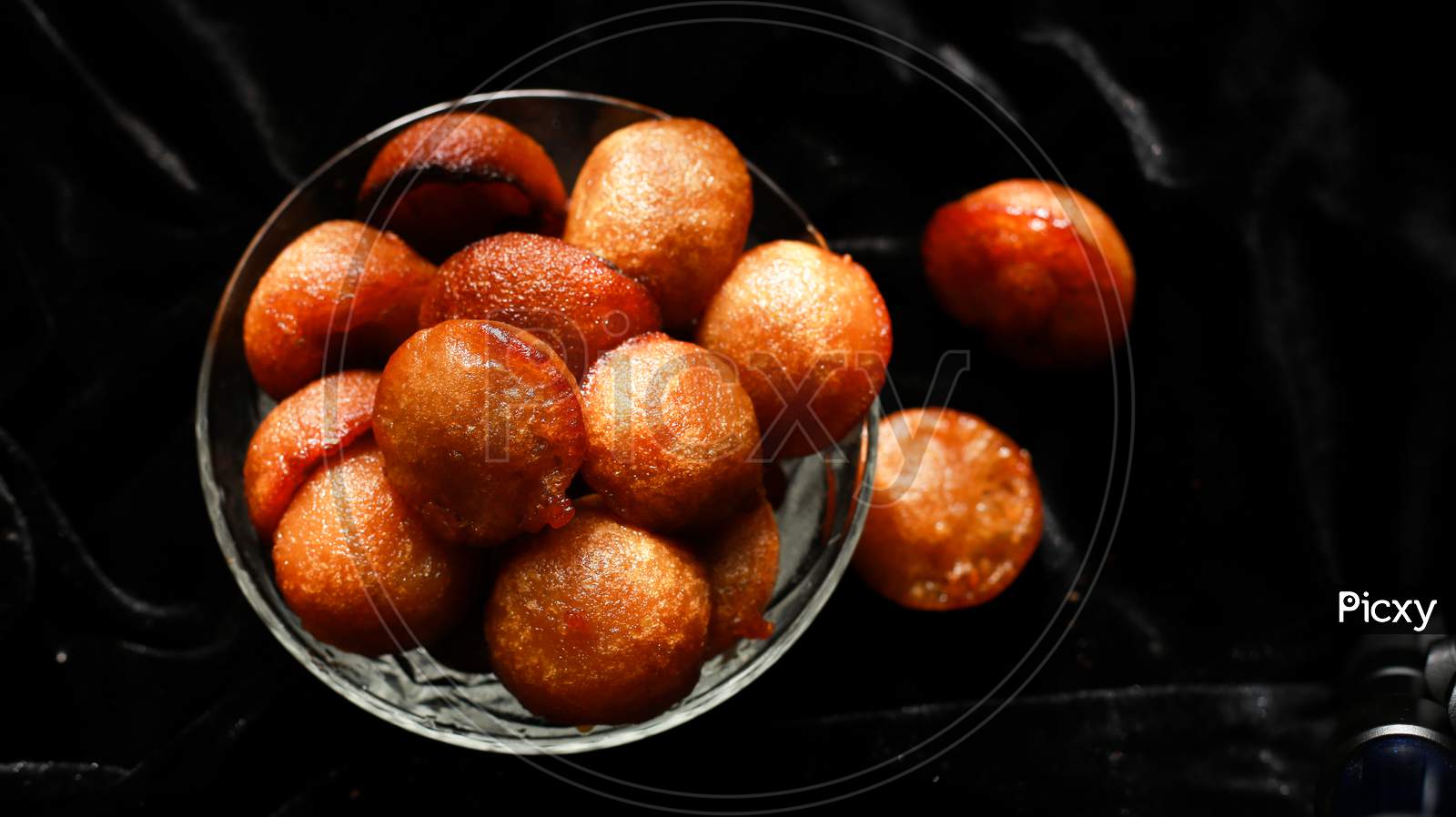Homemade Kerala snack unniyappam in dark background