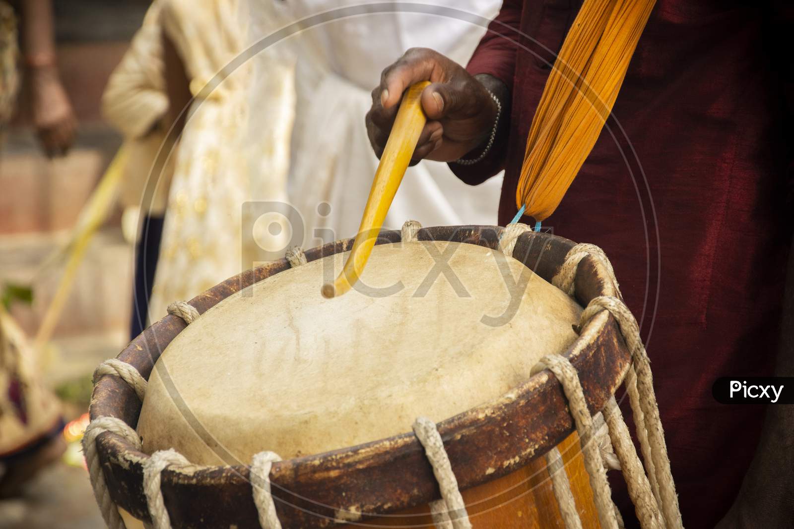 Close Up Of Hands Performing Indian Art Form Chanda Or Chande Cylindrical Percussion Drums Playing During Ceremony