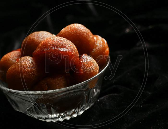 Homemade Kerala sweet snack, delicious Kerala snack unniyappam in dark background