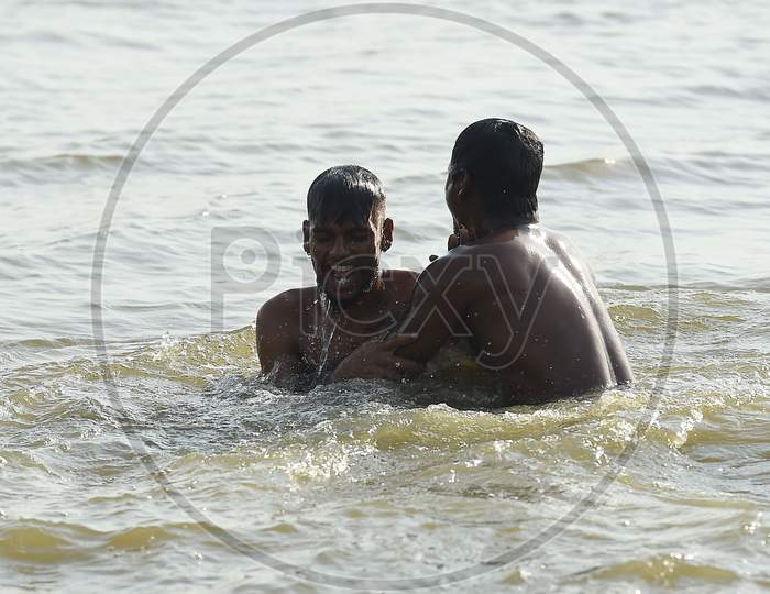 People Swim In A Lake To Beat The Heat on the Outskirts Of Chennai