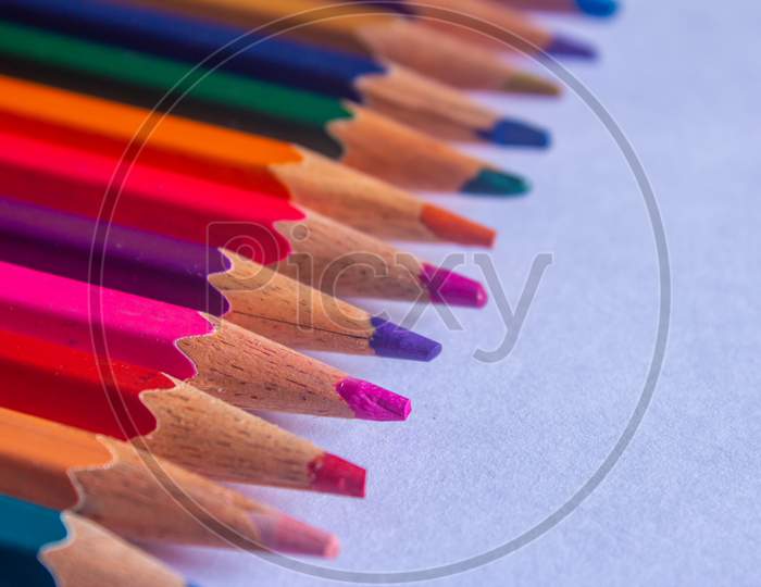 Color Pencils Arranged In A Creative Way. Student Art Supplies.