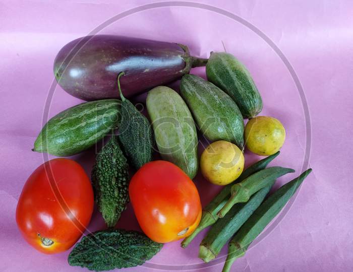 Vegetables on colour background.