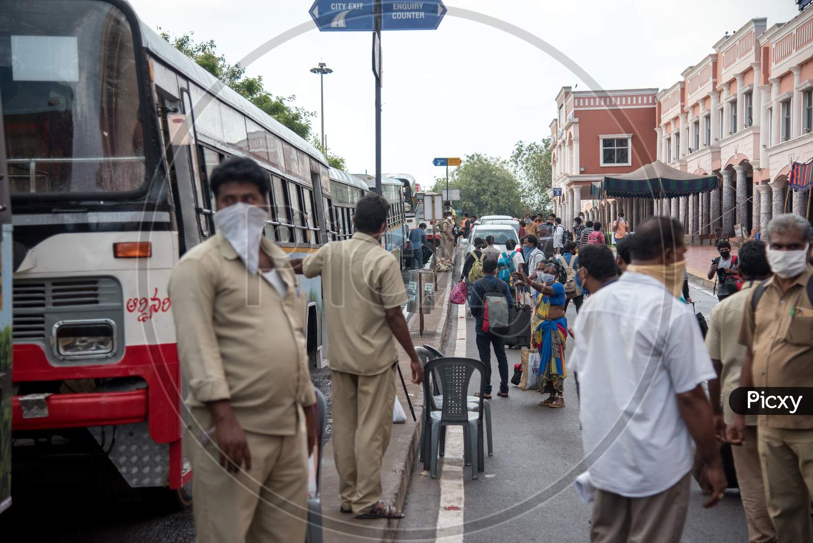 people boarding buses from Visakhapatnam railway station to Vijayanagaram and Srikakulam