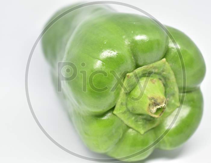 Green Bell Pepper On White Background.