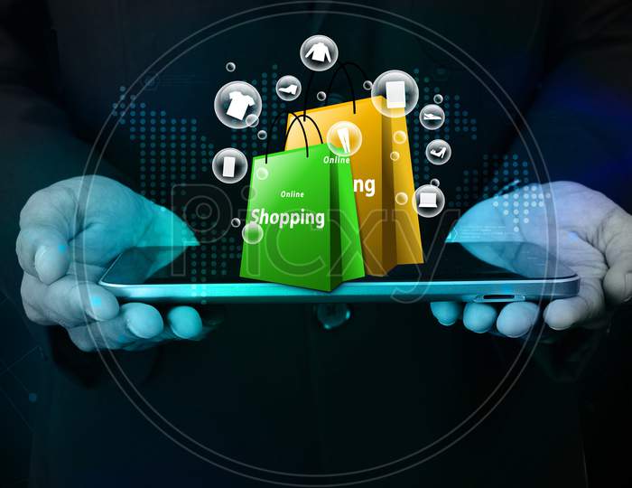 Business Man Showing Online Shopping Concept In Color Background