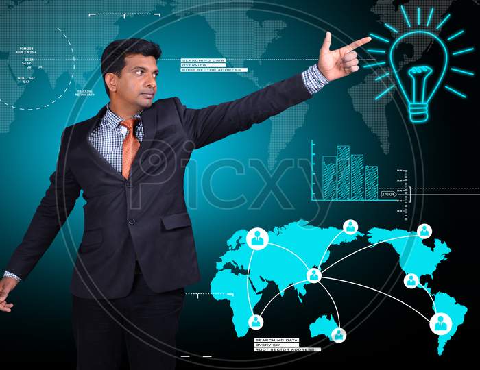 Young Indian Man Pointing finger towards a Bulb