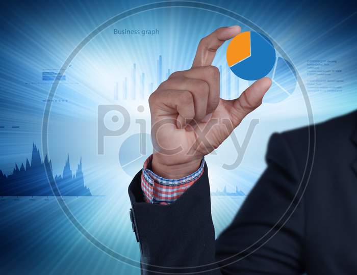 Close up shot of Person's Hand holding a Pie Chart