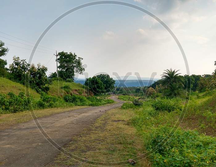 Landscape View Of A Narrow Broken Village Road In A Rural Area