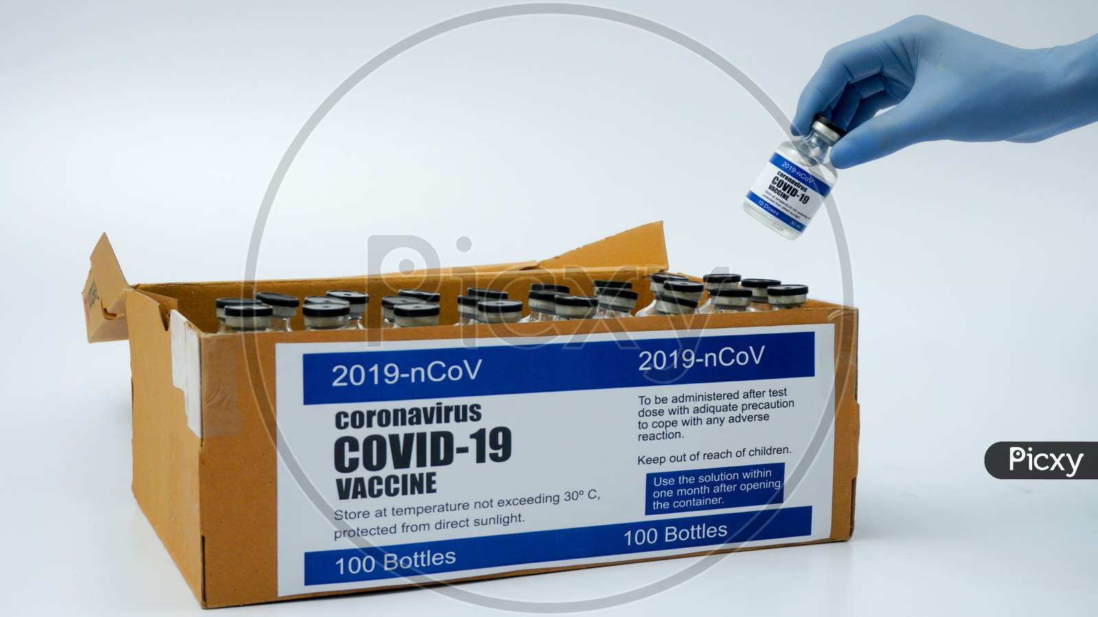 Covid-19 Corona Virus 2019-Ncov Vaccine Vials Medicine Drug Bottles Injection Blue Nitrile Surgical Gloves Box. Vaccination, Immunization, Treatment To Cure Covid 19 Corona Virus Infection Concept.