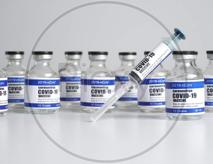 2019-Ncov Covid-19 Corona Virus Drug Vaccine Vials Medicine Bottles Syringe Injection. Sars-Cov-2 Vaccination, Immunization, Treatment To Cure Covid 19 Corona Virus Infection. Medical Concept.