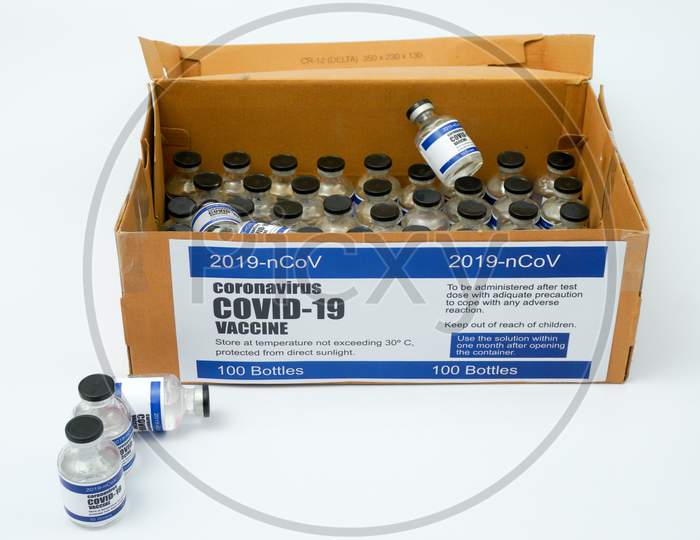 Covid-19 Corona Virus 2019-Ncov Sars-Cov-2 Vaccine Medicine Drug Vials Bottles Syringe Box. Vaccination, Immunization, Treatment To Cure Covid 19 Corona Virus Infection Concept. White Background.