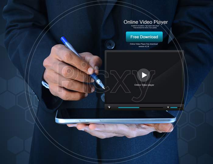 Business Man Showing Play Button On Tablet