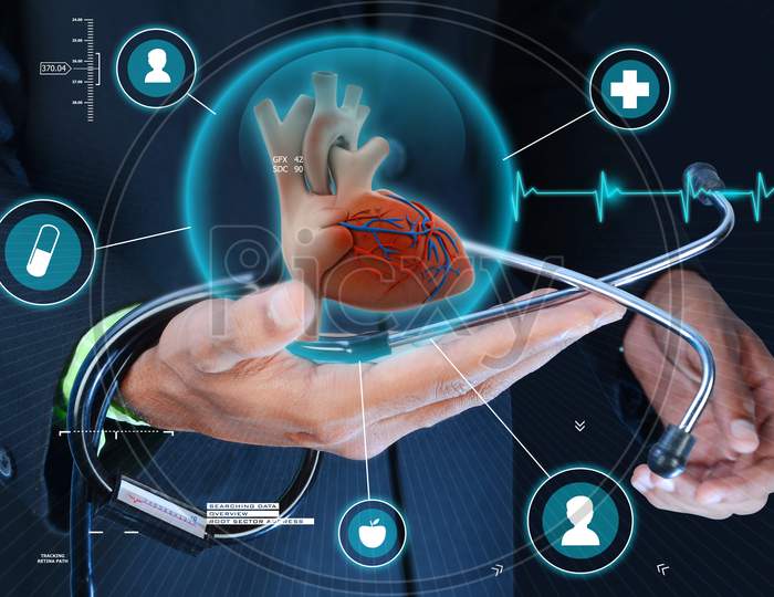 Smart Hand Showing Human Heart And Stethoscope