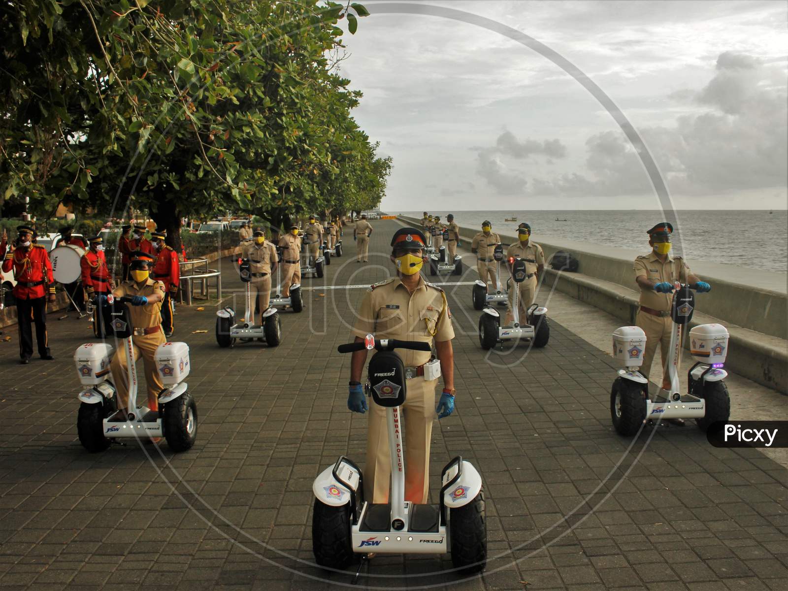Mumbai Police officials ride Segways at the launch of ‘FREEGO self balancing scooter/Segway electric scooter’ for police patrolling on sea facing promenades in Mumbai, India on June 11, 2020.