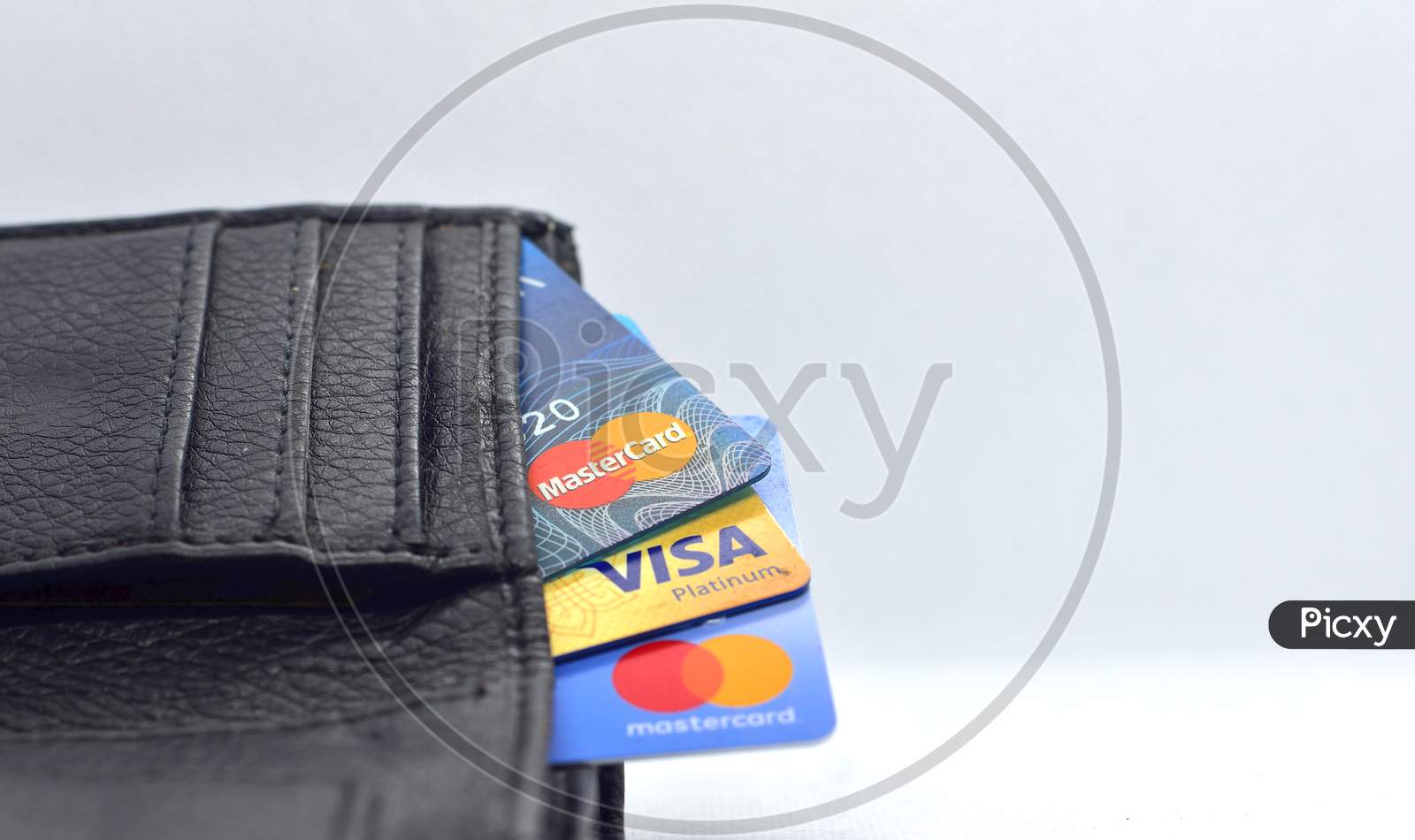 Debit And Credit Cards In Wallet On White Background. Side View
