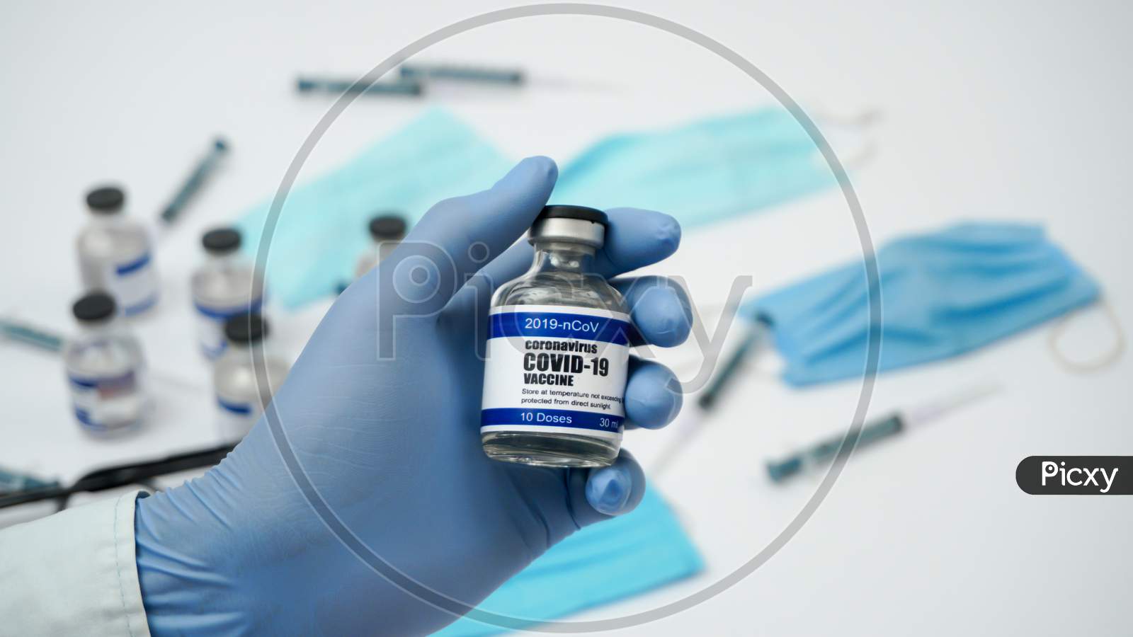 Covid-19 Corona Virus 2019-Ncov Vaccine Vials Medicine Drug Ampoule Bottle Closeup Syringe Injection Medical Nitrile Gloves Mask Glasses. Vaccination, Treatment To Cure Covid 19 Corona Virus Infection