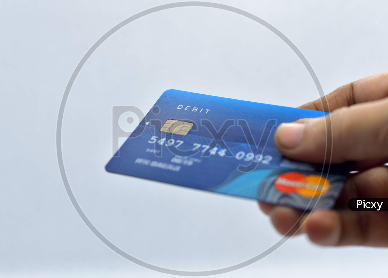 Closeup  Of Card In Hand On White Background