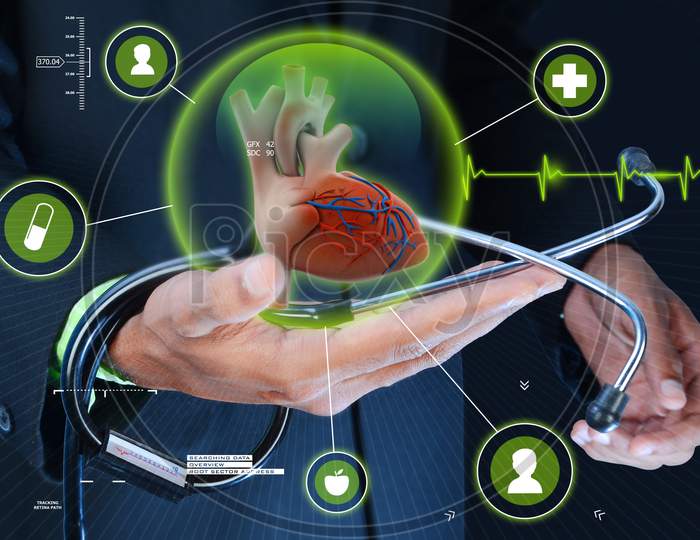 Smart Hand Showing Human Heart And Stethoscope