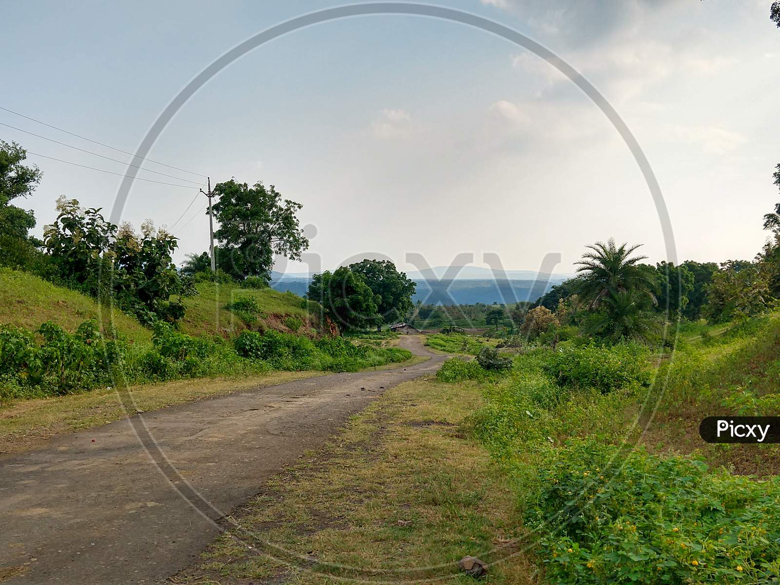 Landscape View Of A Narrow Broken Village Road In A Rural Area