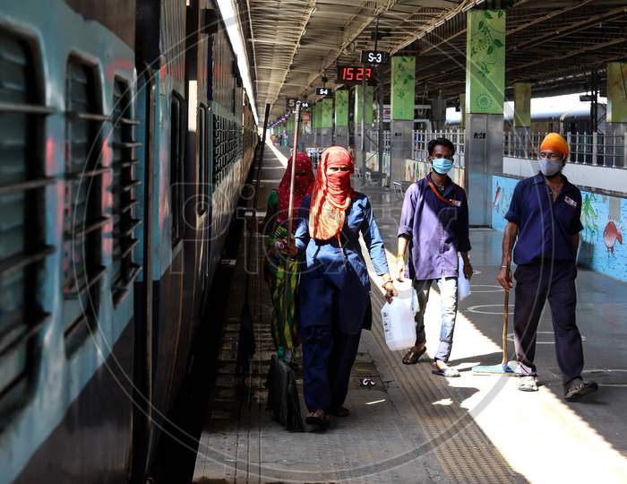 Workers Walk Along A Platform While Carrying On Works To Temporarily Convert Train Carriages Into Covid-19 Isolation Facilities At Anand Vihar Railway Station, In New Delhi On June 17, 2020.